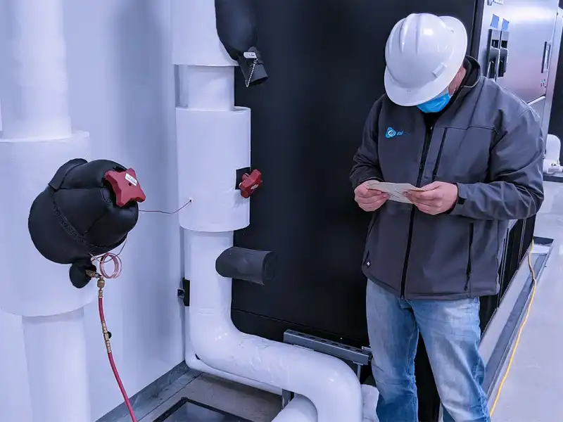 BalCon Tab Technician adjusting air dampers.