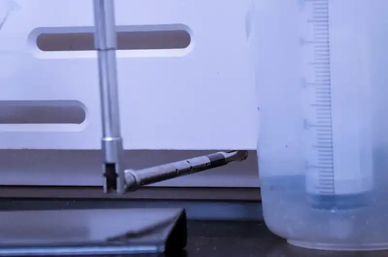 BalCon Tab Technician modulating a damper in a fume hood
